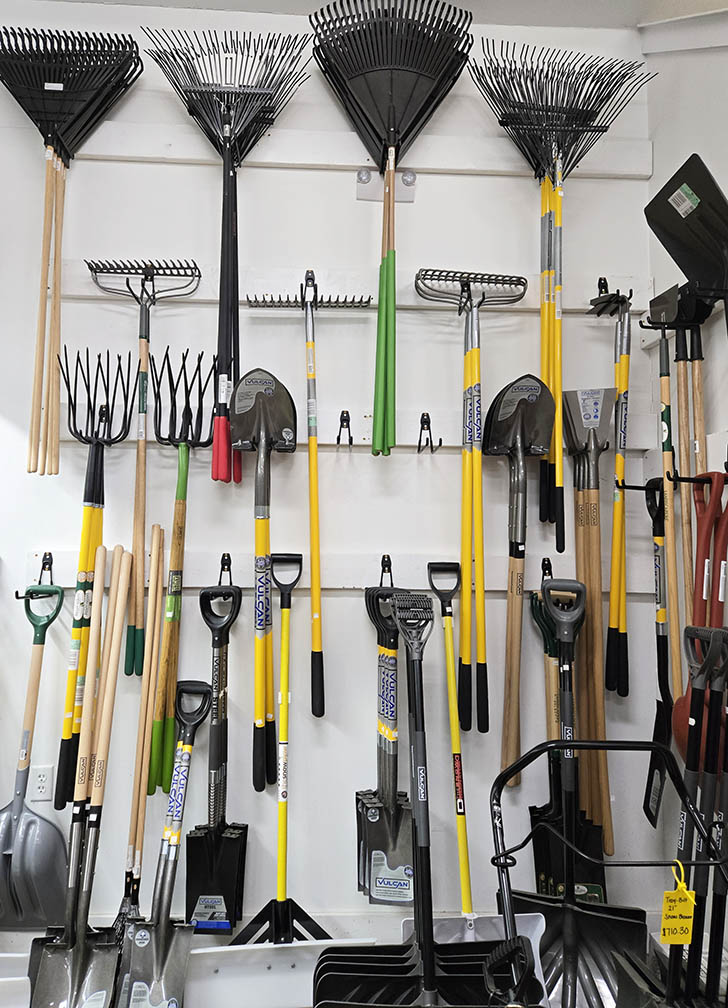 Rack of rakes and shovels