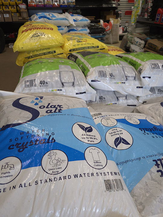 Bags of water softener salt and ice melt